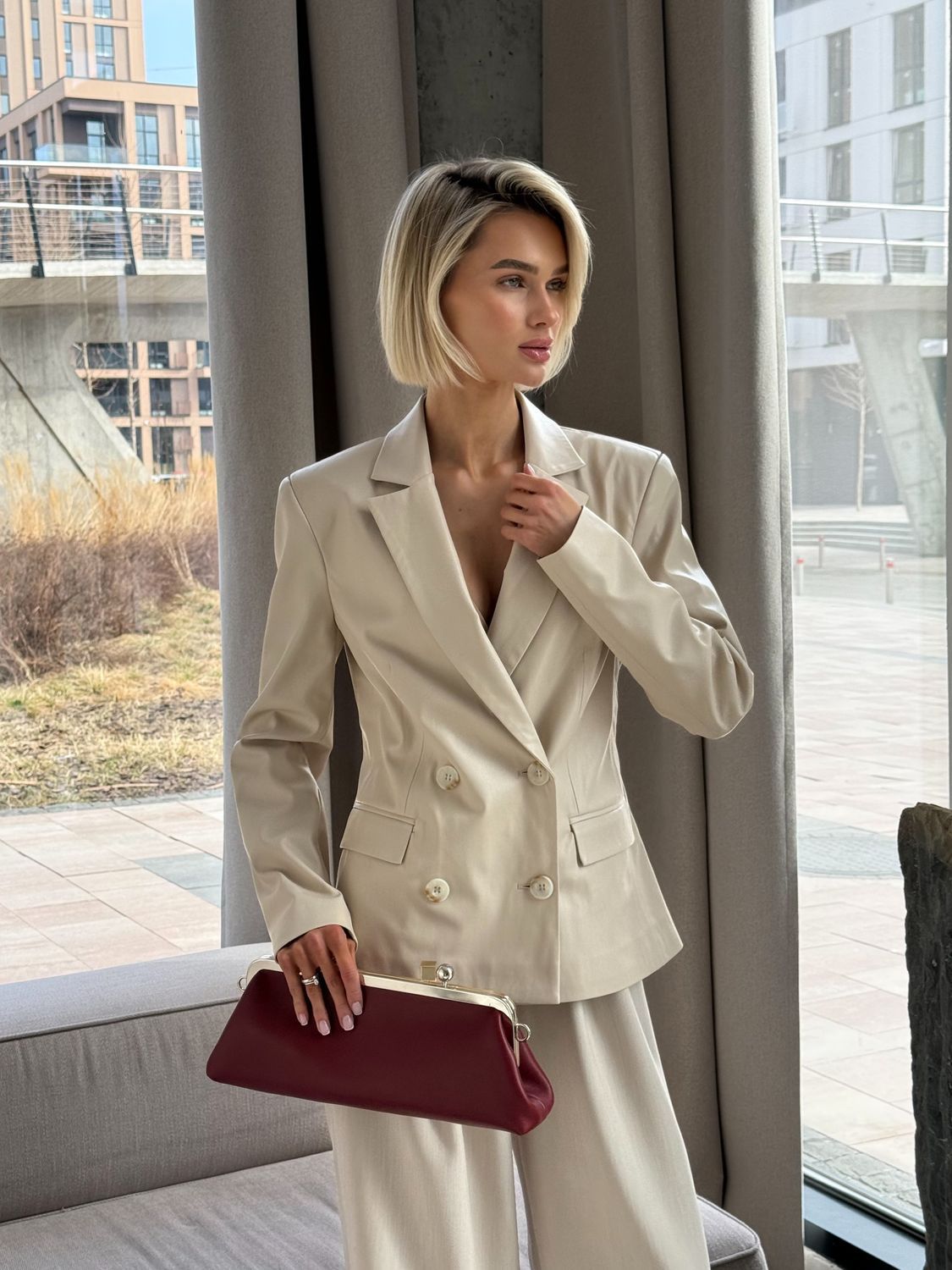 Milk-colored fitted faux leather jacket