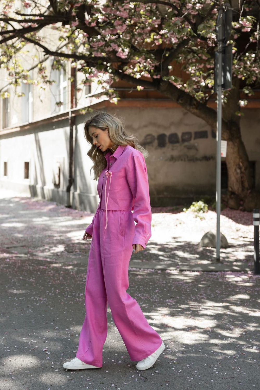 Pink linen suit with a cropped shirt and palazzo trousers